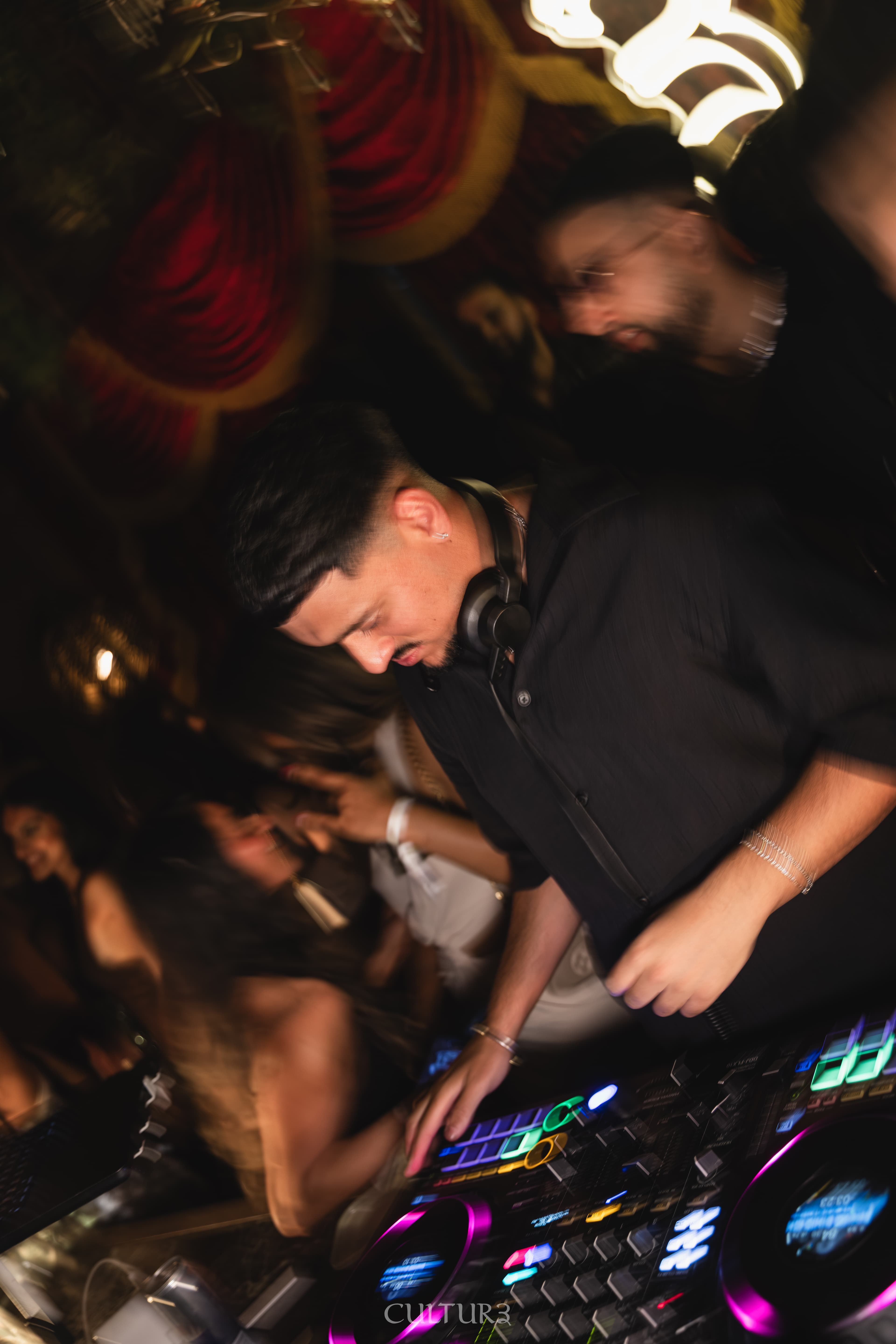 DJ AJ performing to a packed dance floor