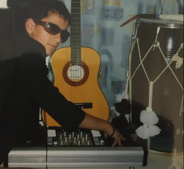 AJ aged 10 practising on DJ decks in his bedroom