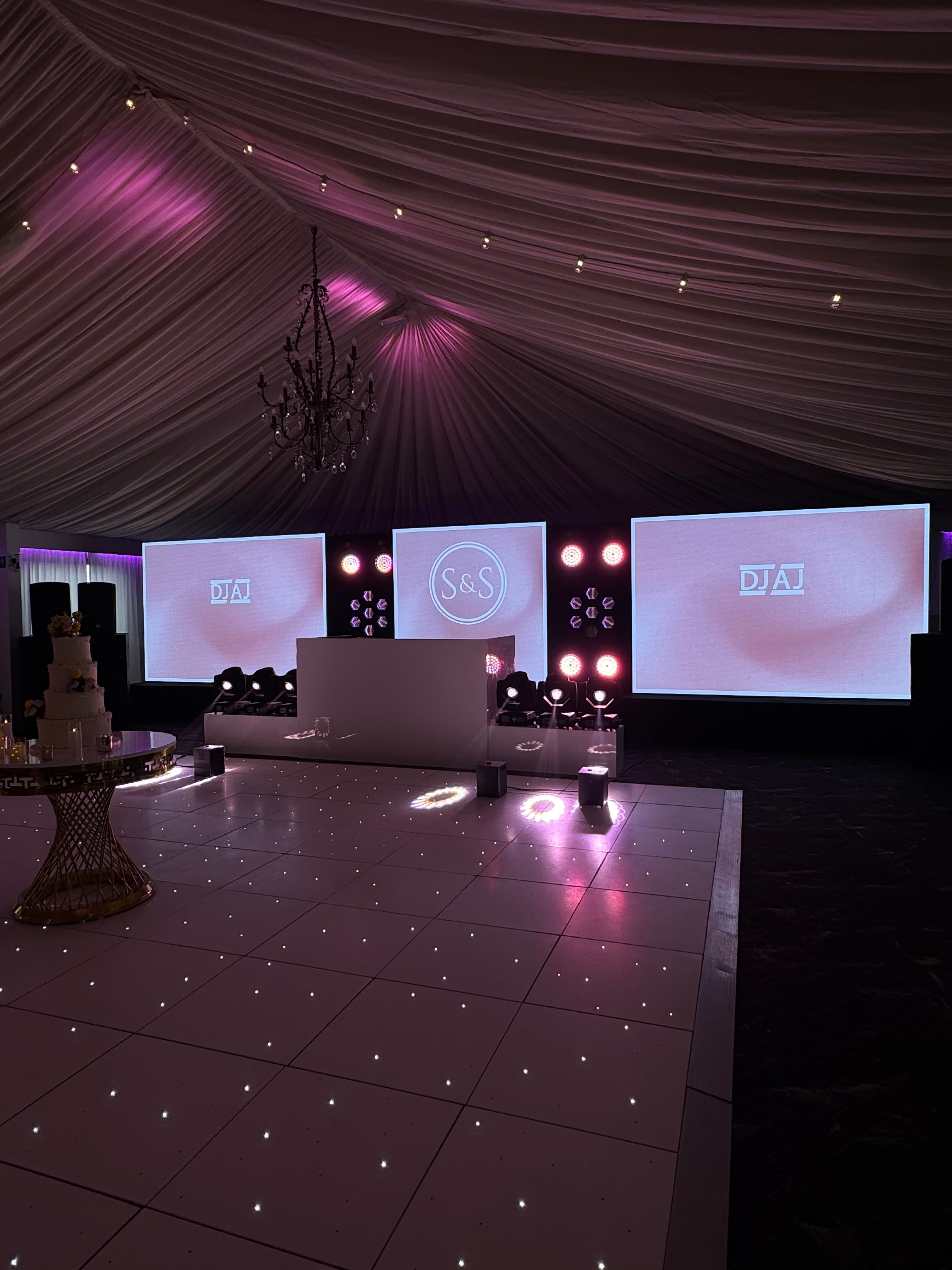 Custom wedding setup with screens, lighting and an LED dance floor